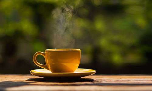 Close-up of coffee cup on table