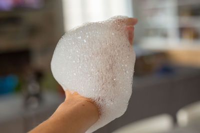 Close-up of hand holding bubbles