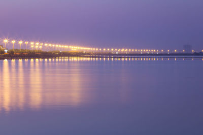 Illuminated city at waterfront