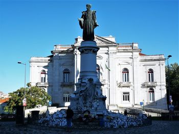 Low angle view of statue against building