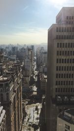 High angle view of buildings in city against sky