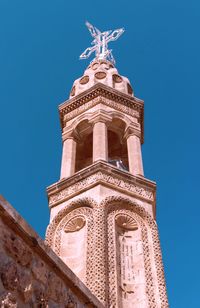 Low angle view of a building against blue sky