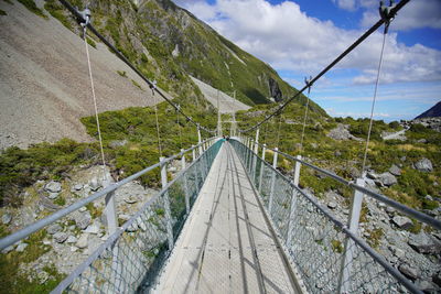 Bridge over road against sky