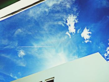 Low angle view of building against blue sky