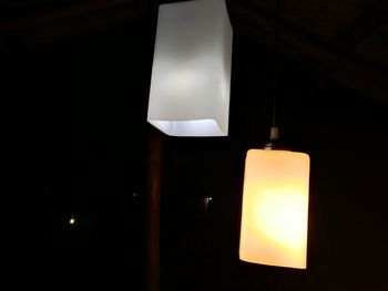 Low angle view of light bulb hanging from ceiling