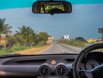 Close-up of vintage car on road