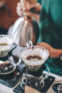 Close-up of preparing pouring coffee in glass