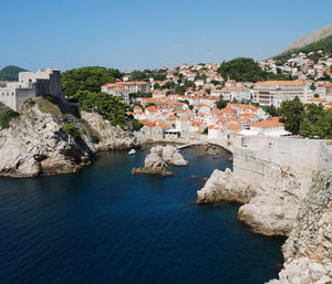 High angle view of town by sea