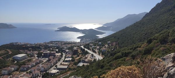 High angle view of townscape by sea against sky