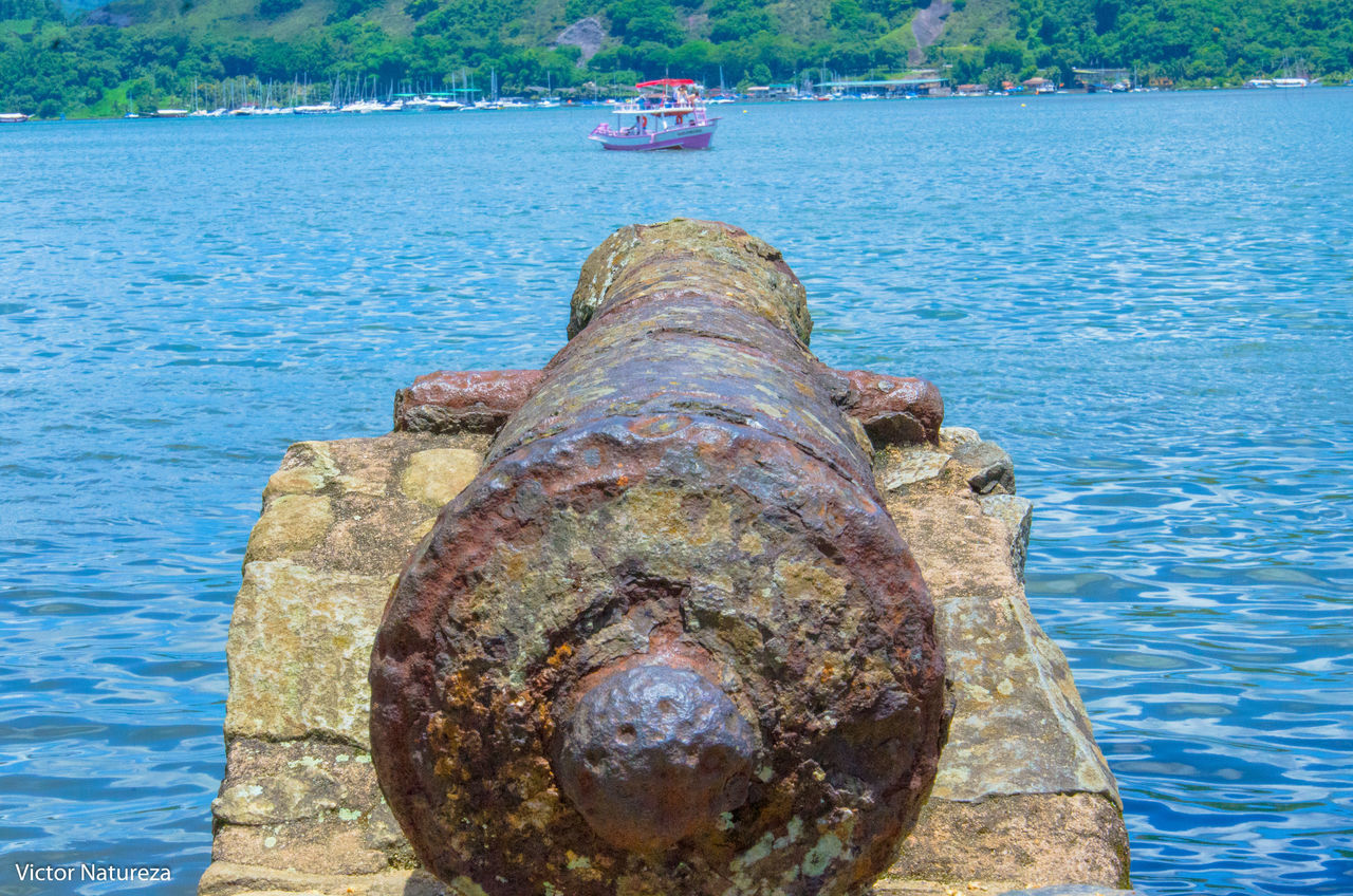 water, weapon, day, outdoors, history, no people, nautical vessel, canon, transportation, cannon, close-up, nature, tree