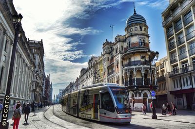 People on city street with buildings in background