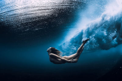 Woman swimming in sea