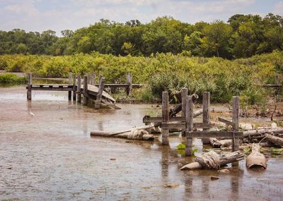 Scenic view broken bridge against sky