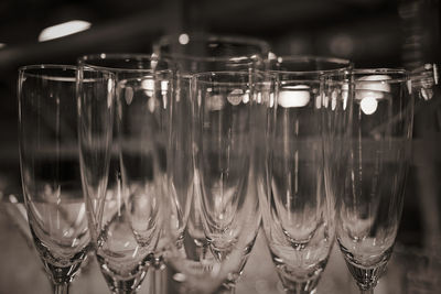 Close-up of champagne glasses on table