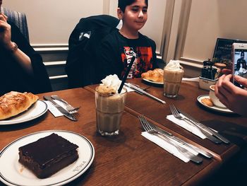 High angle view of man having food in restaurant