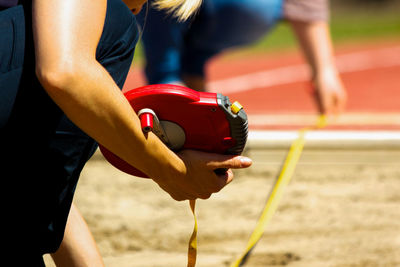 Cropped women with measuring tape