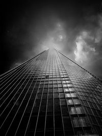 Low angle view of bridge against cloudy sky