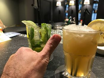 Cropped image of hand holding drink