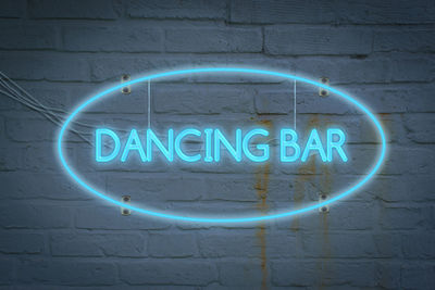 Leon lighton the wall with the word dancing bar