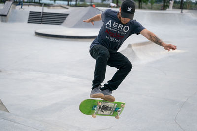 Full length of man skateboarding on skateboard