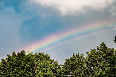 Low angle view of rainbow against sky