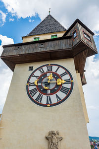 Low angle view of clock tower against sky