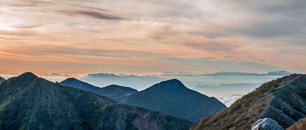 Panoramic view of mountains against sky during sunset