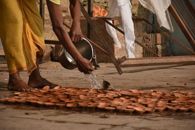 Low section of people working on wood