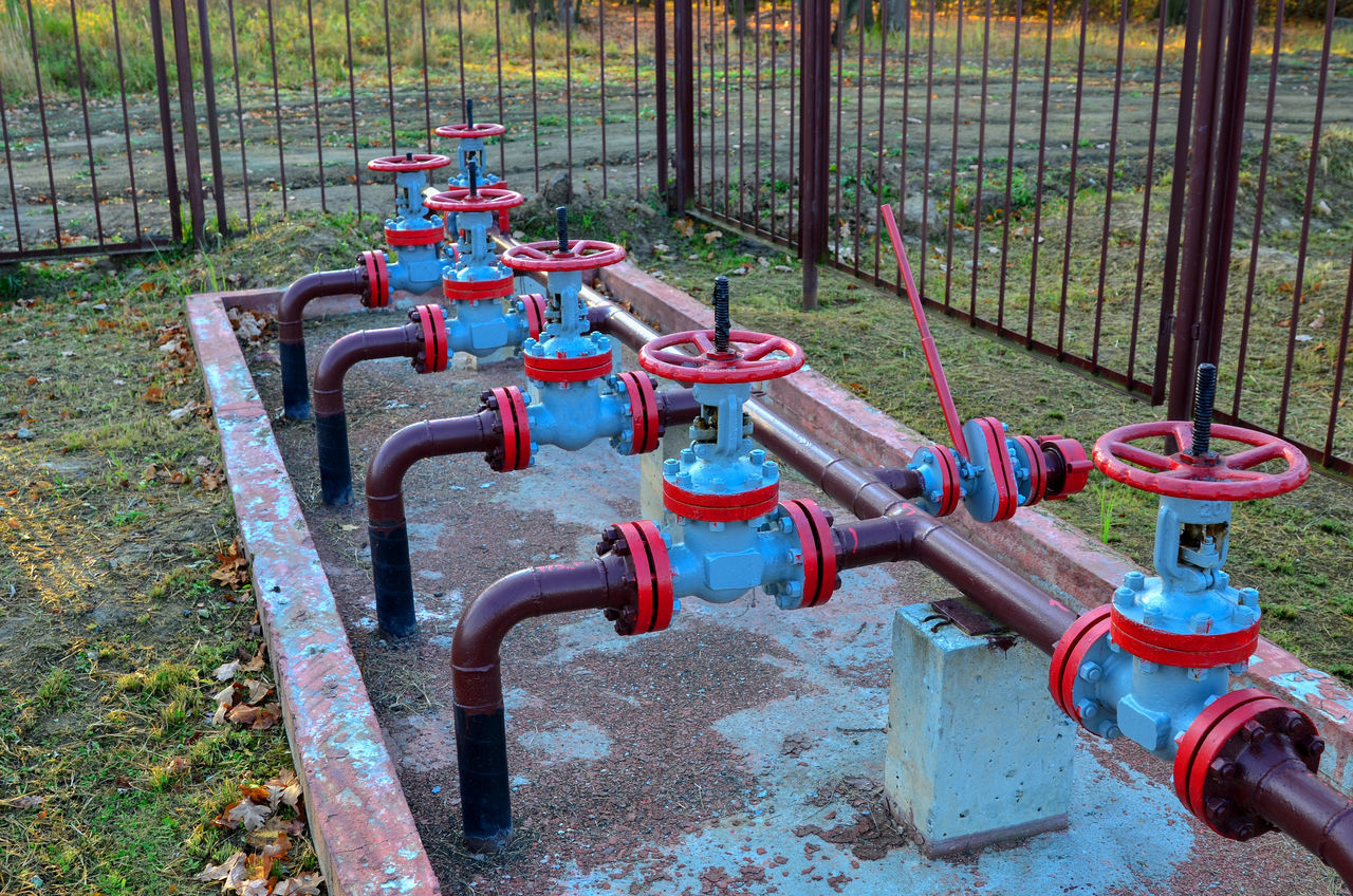 RED FIRE HYDRANT BY FENCE