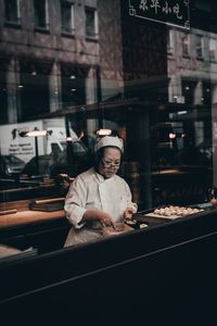 Portrait of man working at restaurant