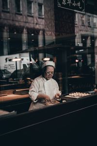 Portrait of man working at restaurant