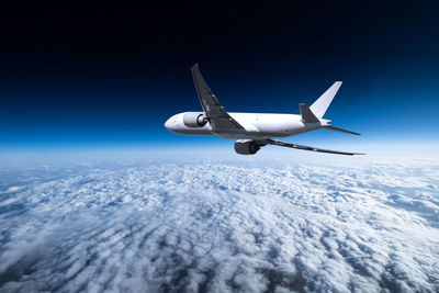 Cropped image of airplane wing against clear sky