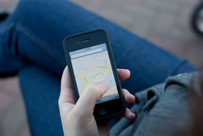 Close-up of hand holding mobile phone