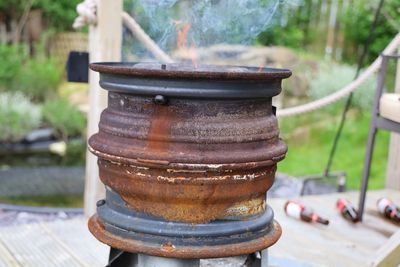 Close-up of old stack on table at yard