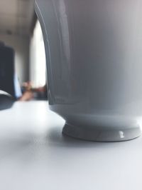 Close-up of coffee cup on table