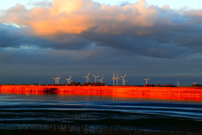 Scenic view of field against sky during sunset