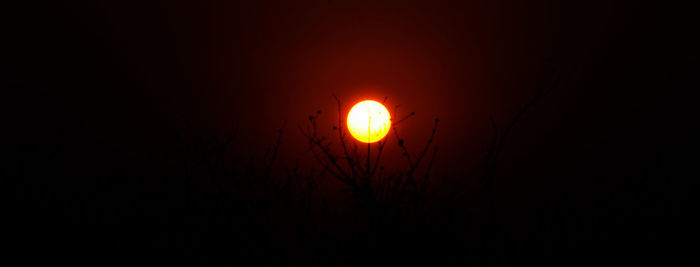 Low angle view of orange sky at night