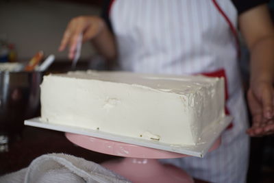 Midsection of woman preparing food