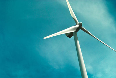 Low angle view of wind turbine against sky