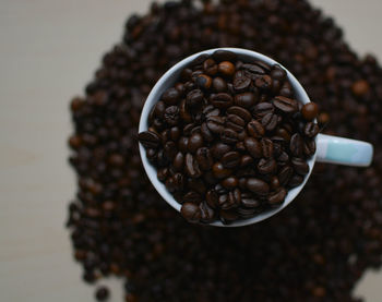 Close-up of coffee beans on table