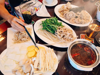 Close-up of man preparing food on table