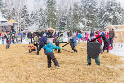 Group of people on field during winter