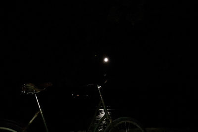 Close-up of illuminated bicycle at night