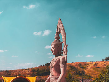 Statue of temple against sky