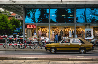 Bicycles on street against buildings in city