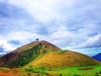 Low angle view of mountain against blue sky