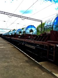 Railroad tracks against blue sky