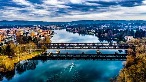 High angle view of bridge over river in city against sky