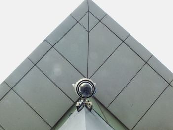 Low angle view of communications tower against sky