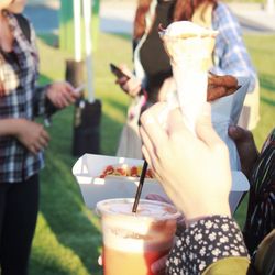 Cropped image of people with food and drink